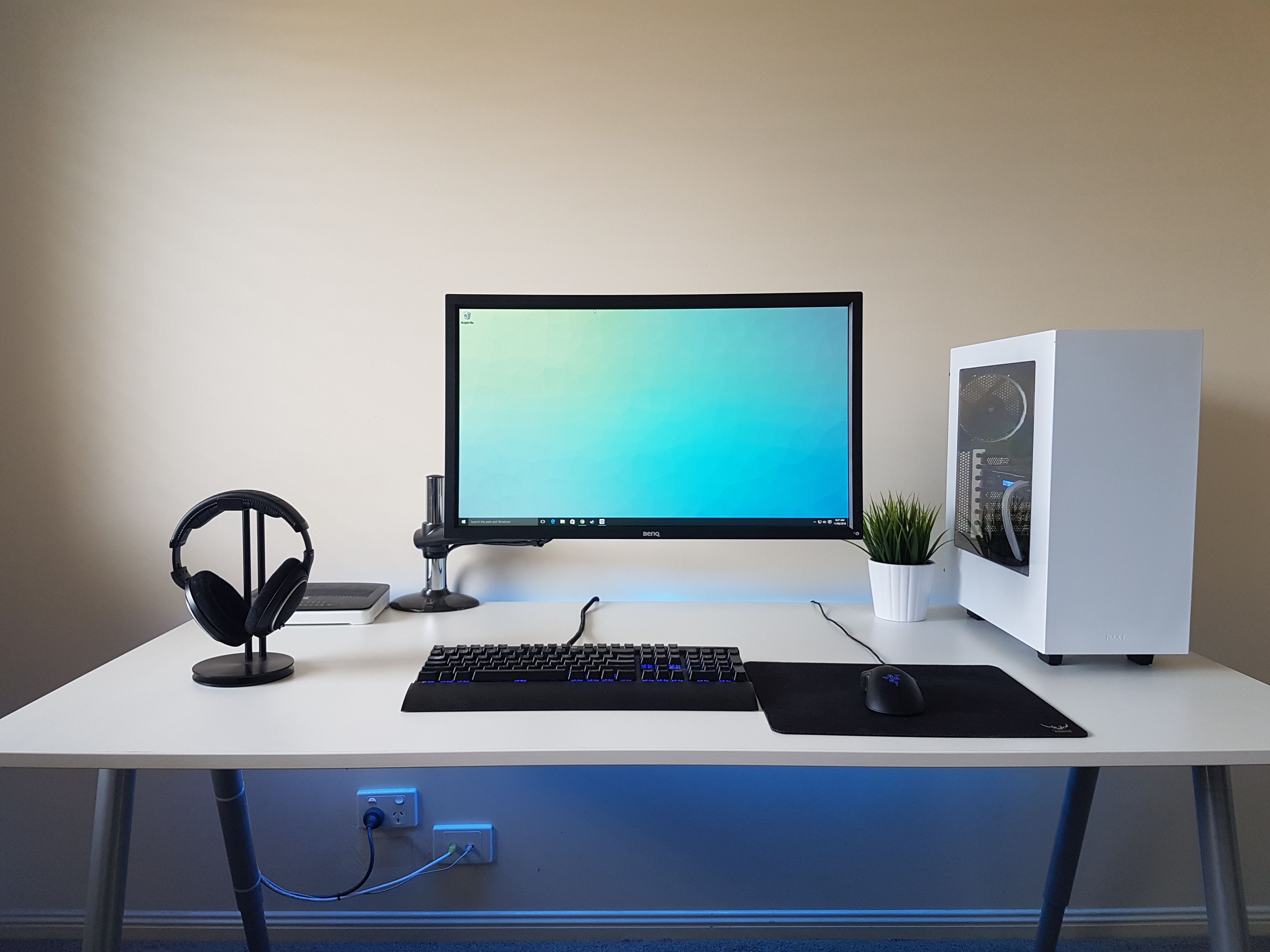 Minimalist tech workspace with gaming accessories and clock